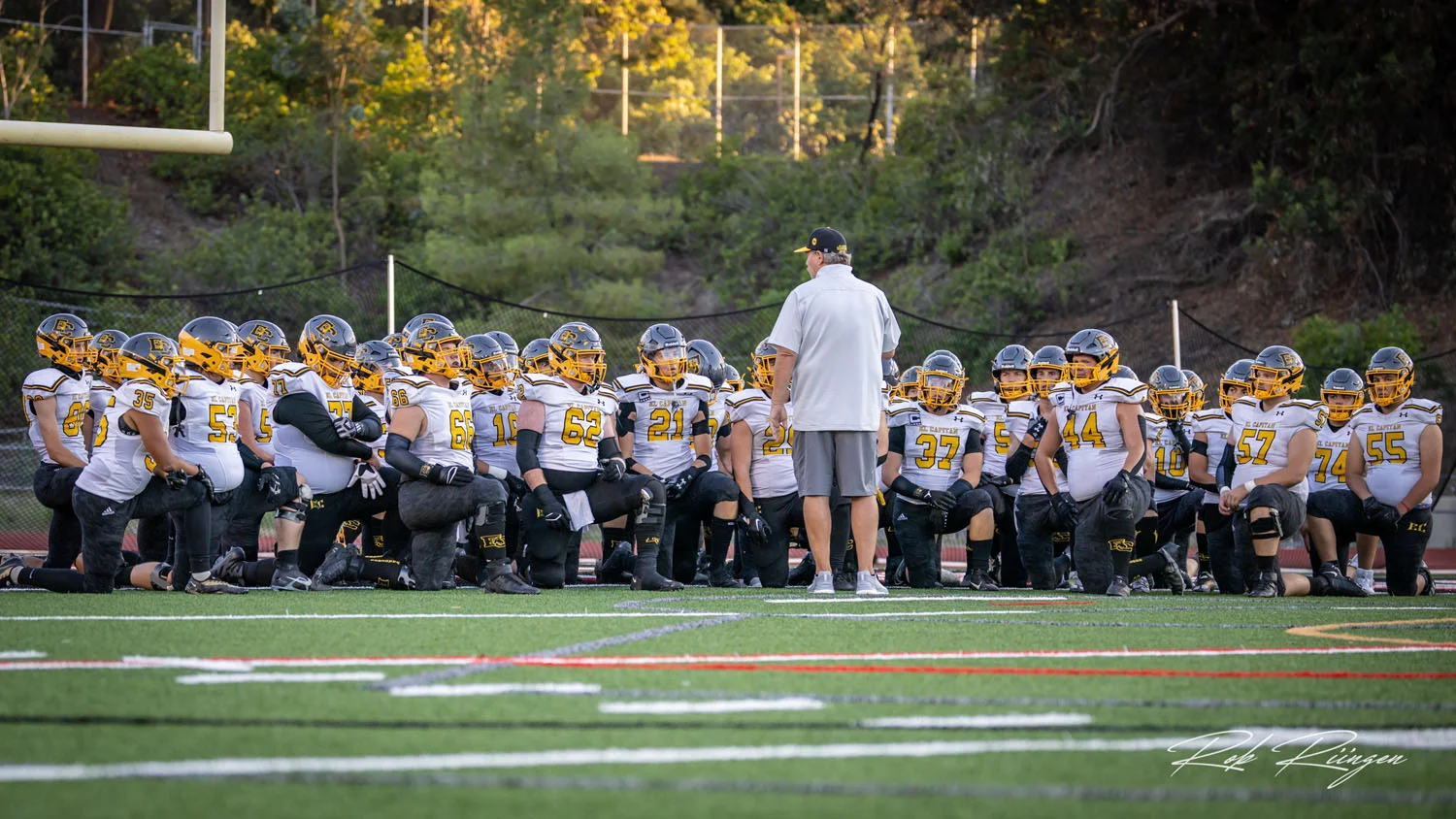 Coach talking to his team before the game